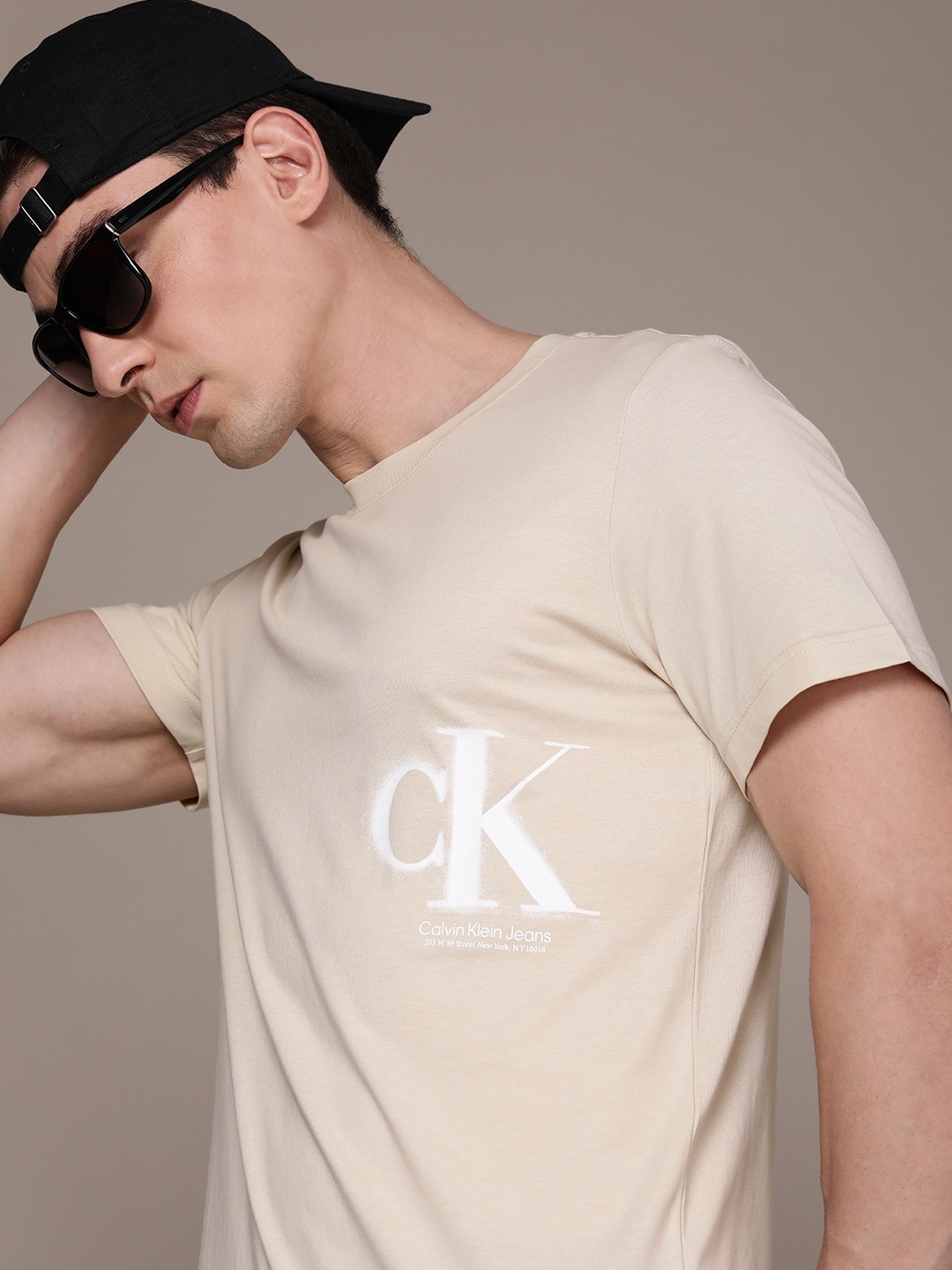 

Calvin Klein Jeans Men Brand Logo Pure Cotton T-shirt, Beige