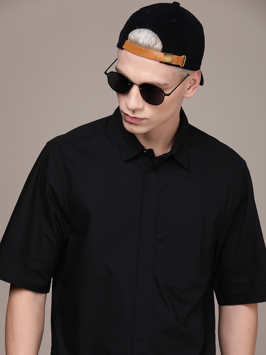 

Calvin Klein Jeans Men Pure Cotton Solid Boxy Fit Casual Shirt, Black