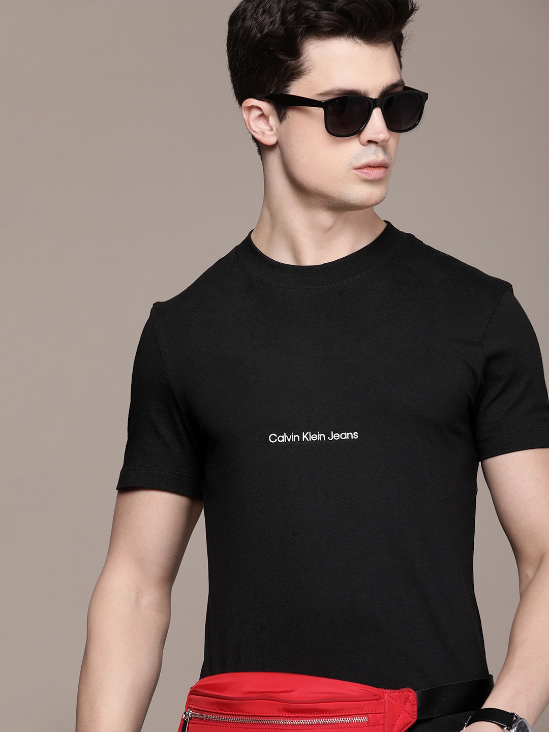 

Calvin Klein Jeans Men Pure Cotton Solid T-shirt With Brand Logo Embroidered Detail, Black