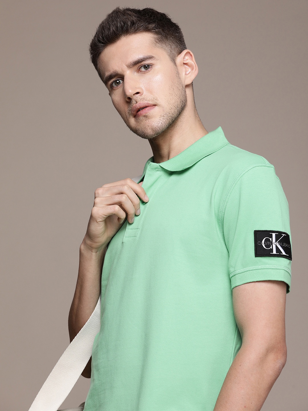 

Calvin Klein Jeans Men Solid Polo Collar T-shirt With Applique Detail, Green