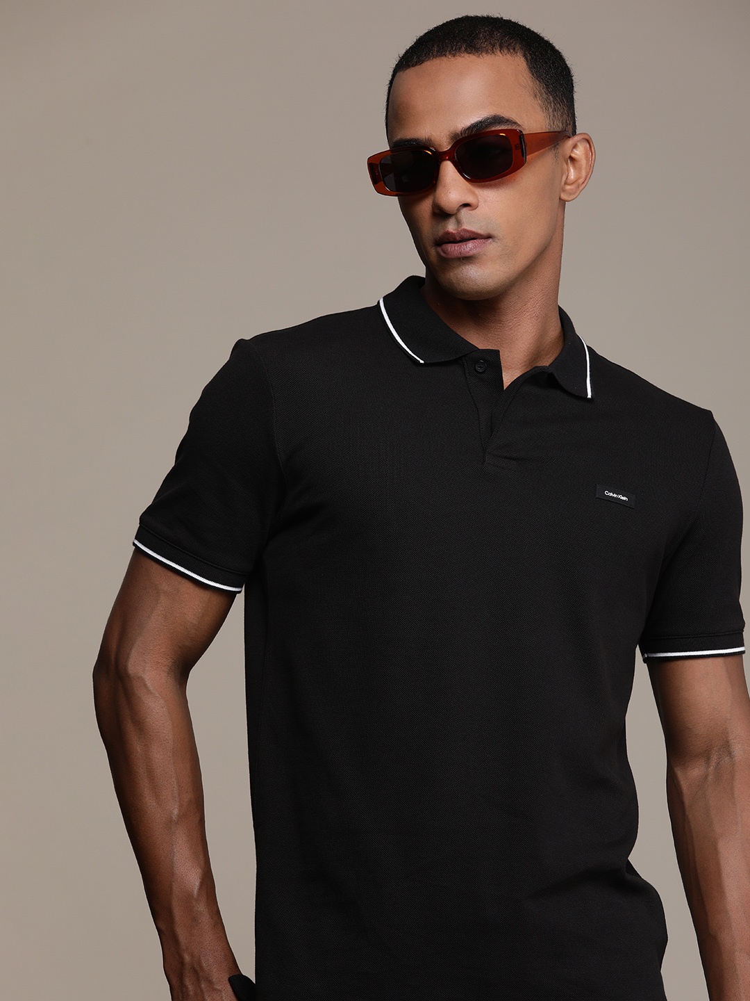 

Calvin Klein Jeans Men Solid Polo Collar Slim Fit T-shirt, Black
