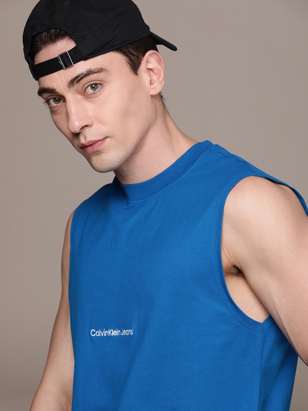 

Calvin Klein Jeans Men Pure Cotton Brand Logo Sleeveless Tank T-shirt, Blue