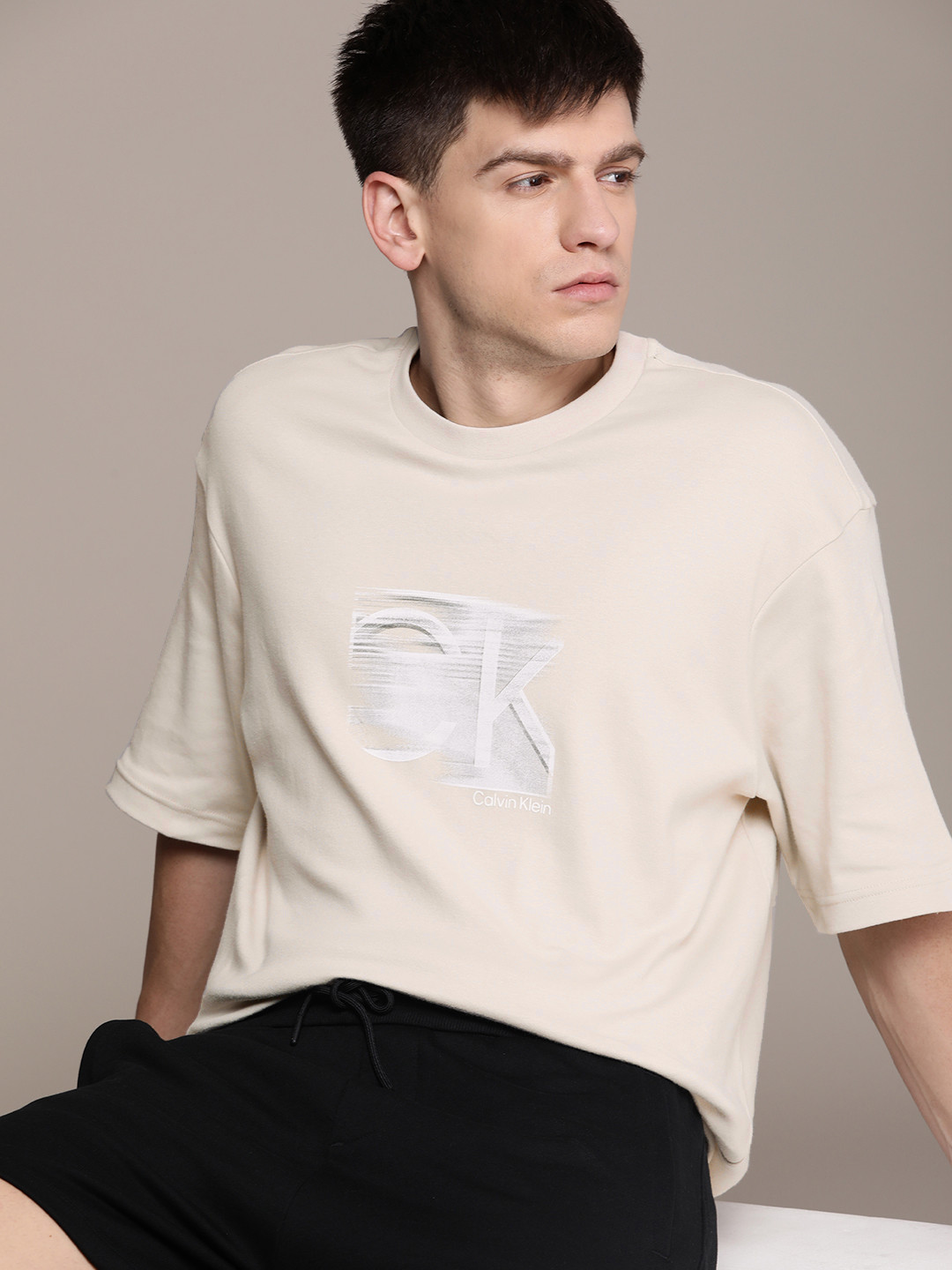 

Calvin Klein Jeans Men Pure Cotton Comfort Fit Brand Logo Printed Drop-Shoulder T-shirt, Beige