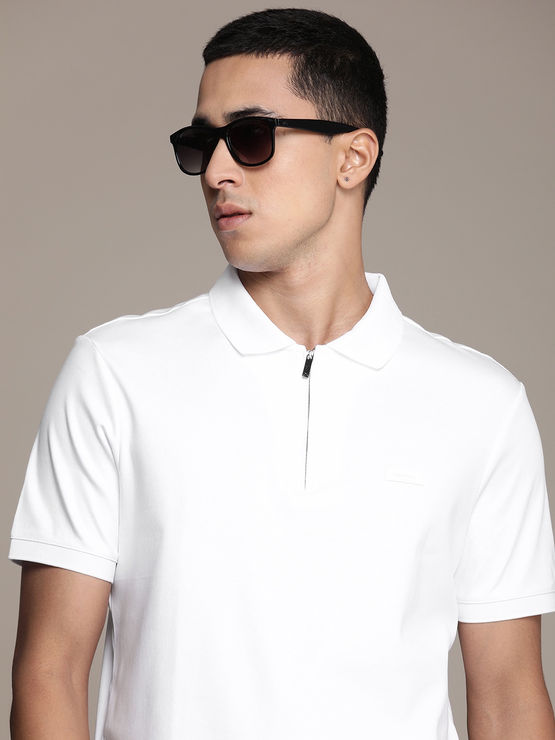

Calvin Klein Jeans Men Pure Cotton Solid Polo Collar T-shirt, White
