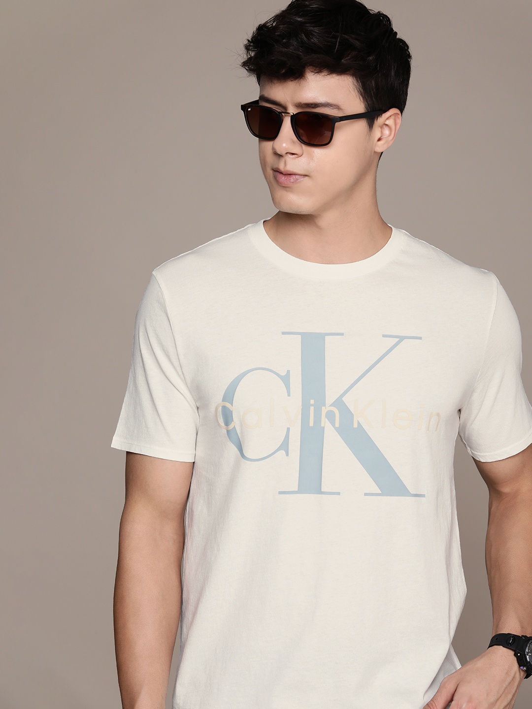 

Calvin Klein Jeans Men Pure Cotton Brand Logo Printed T-shirt, Off white