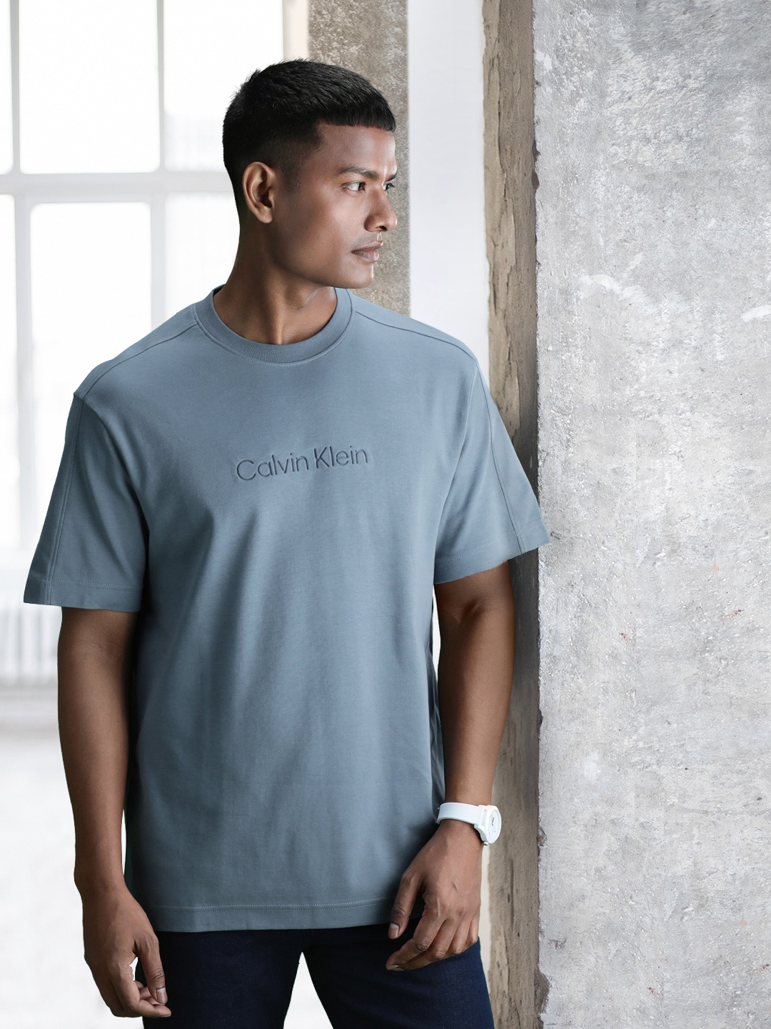 

Calvin Klein Jeans Men Embossed Brand Logo Pure Cotton T-shirt, Blue