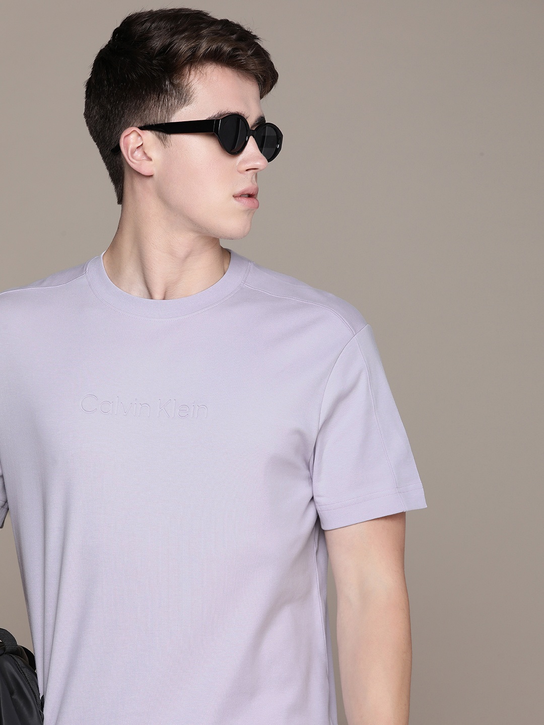 

Calvin Klein Jeans Brand Logo Debossed Drop-Shoulder Sleeves Pure Cotton T-shirt, Lavender