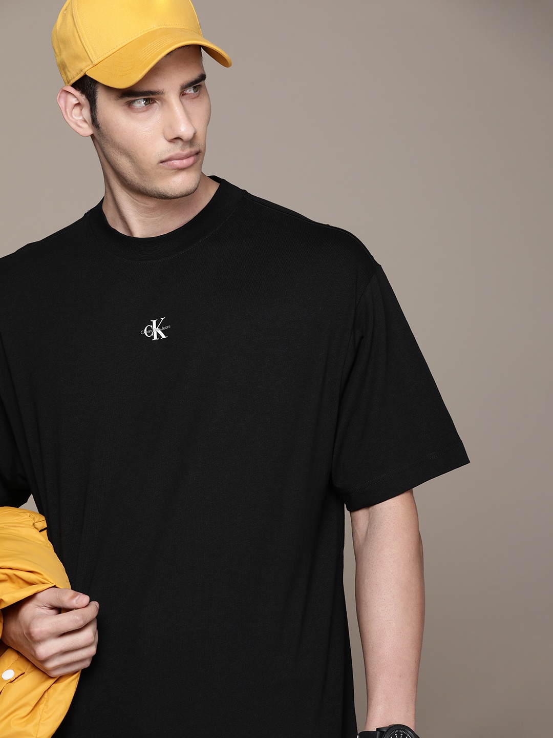 

Calvin Klein Jeans Men Solid Pure Cotton T-shirt, Black