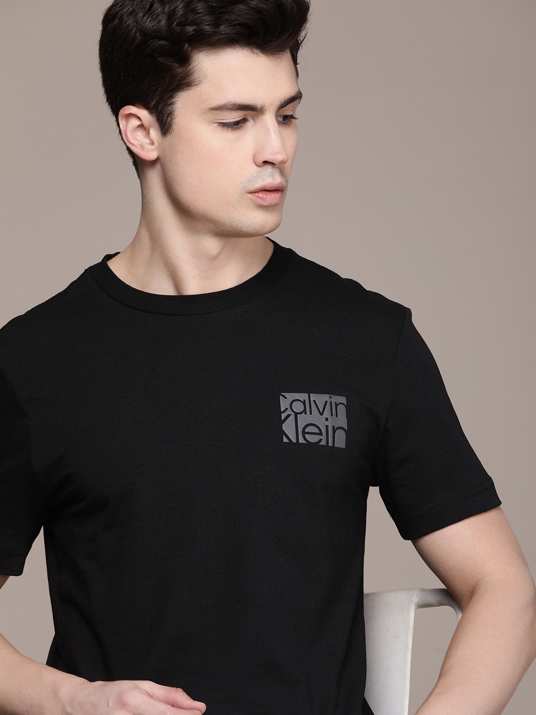 

Calvin Klein Jeans Men Solid Pure Cotton T-shirt With Brand Logo Detail, Black