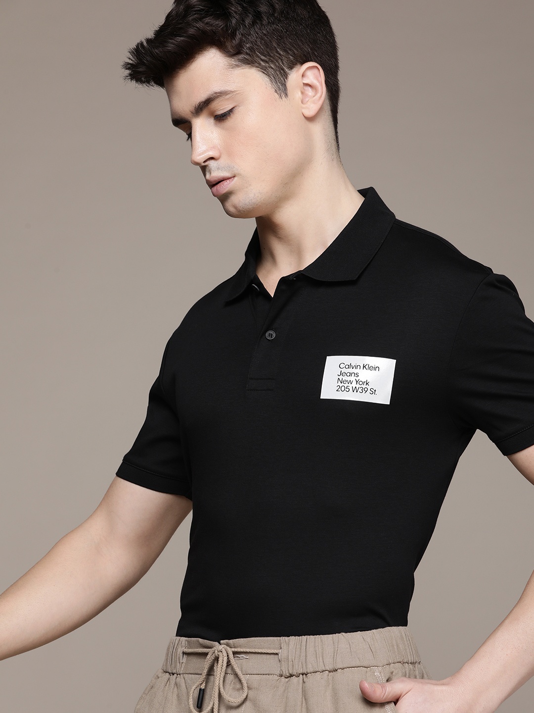 

Calvin Klein Jeans Men Polo Collar Pure Cotton T-shirt, Black