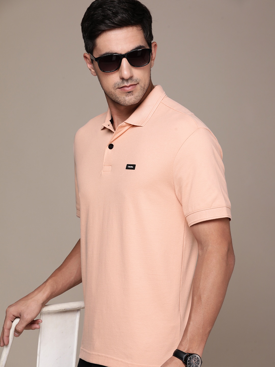 

Calvin Klein Jeans Men Solid Polo Collar T-shirt with Applique Detail, Coral