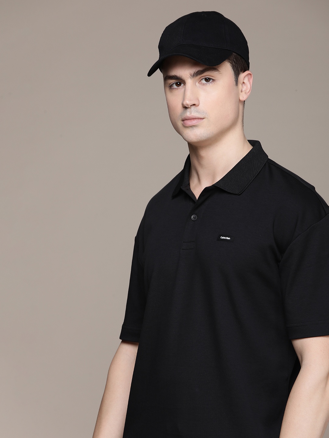 

Calvin Klein Jeans Solid Polo Collar Drop-Shoulder Sleeves Comfort Fit Pure Cotton T-shirt, Black