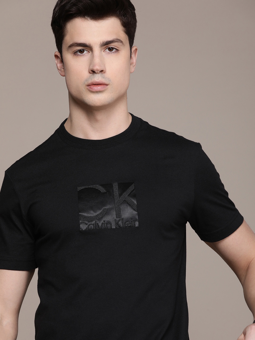 

Calvin Klein Jeans Men Pure Cotton Brand Logo Printed Applique T-shirt, Black