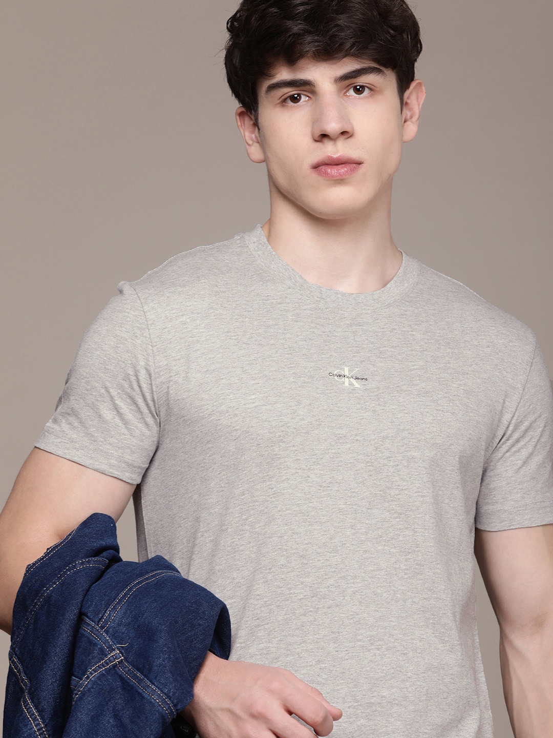 

Calvin Klein Jeans Men Solid Pure Cotton T-shirt, Grey melange