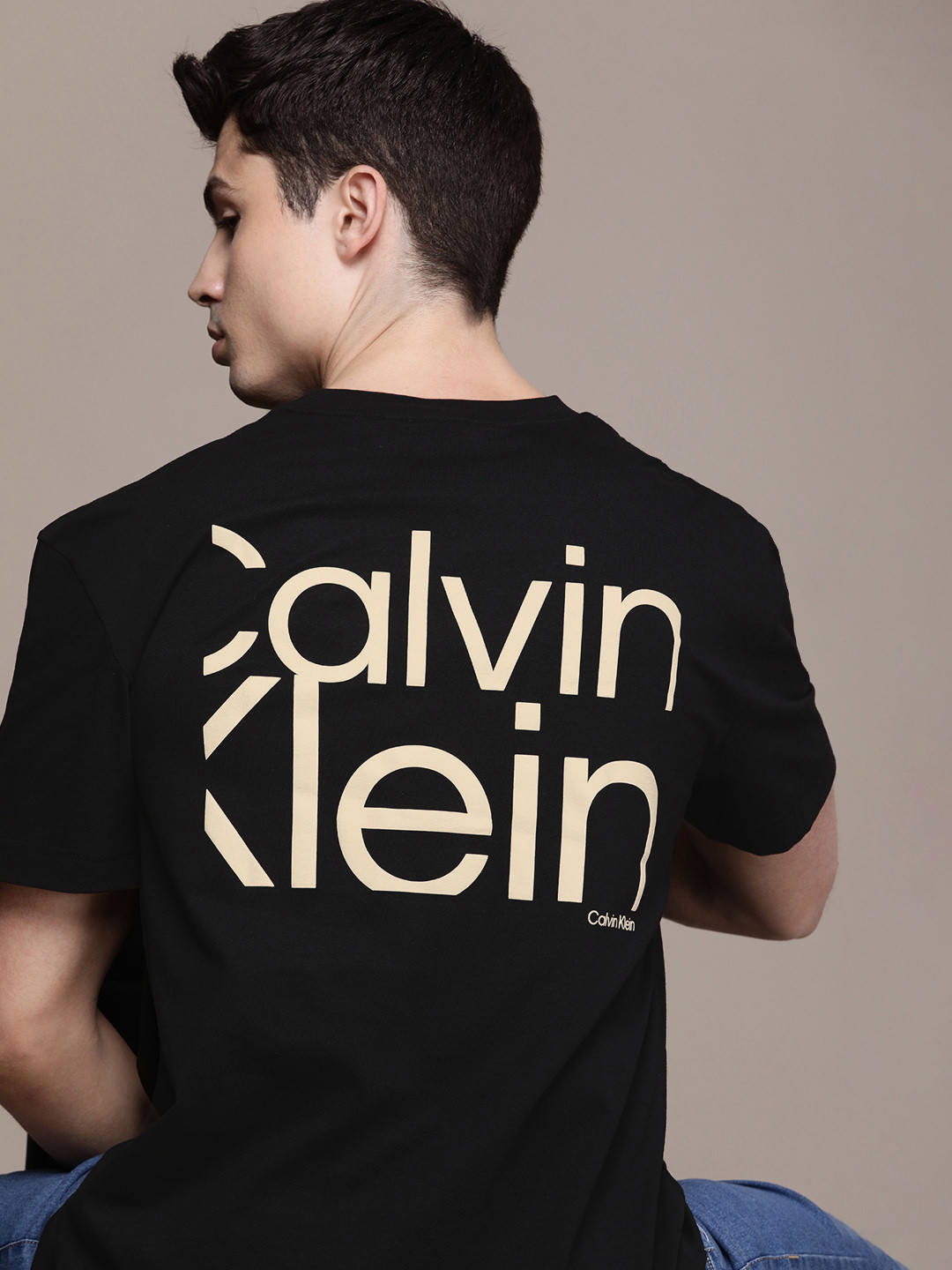 

Calvin Klein Jeans Men Pure Cotton Brand Logo Printed T-shirt, Black