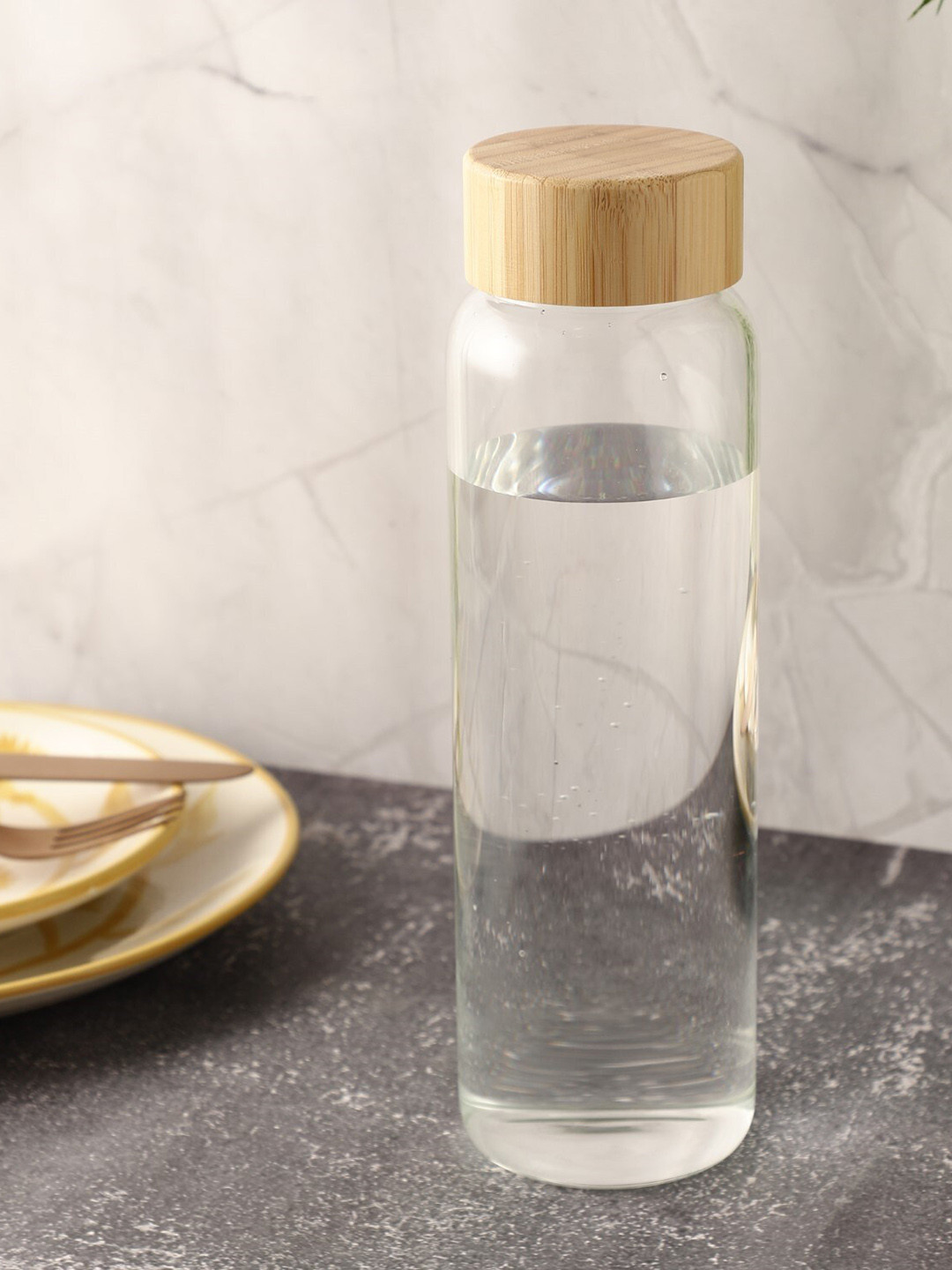 

The Decor Mart Transparent Glass Cylinder Bottle with Wooden Lid