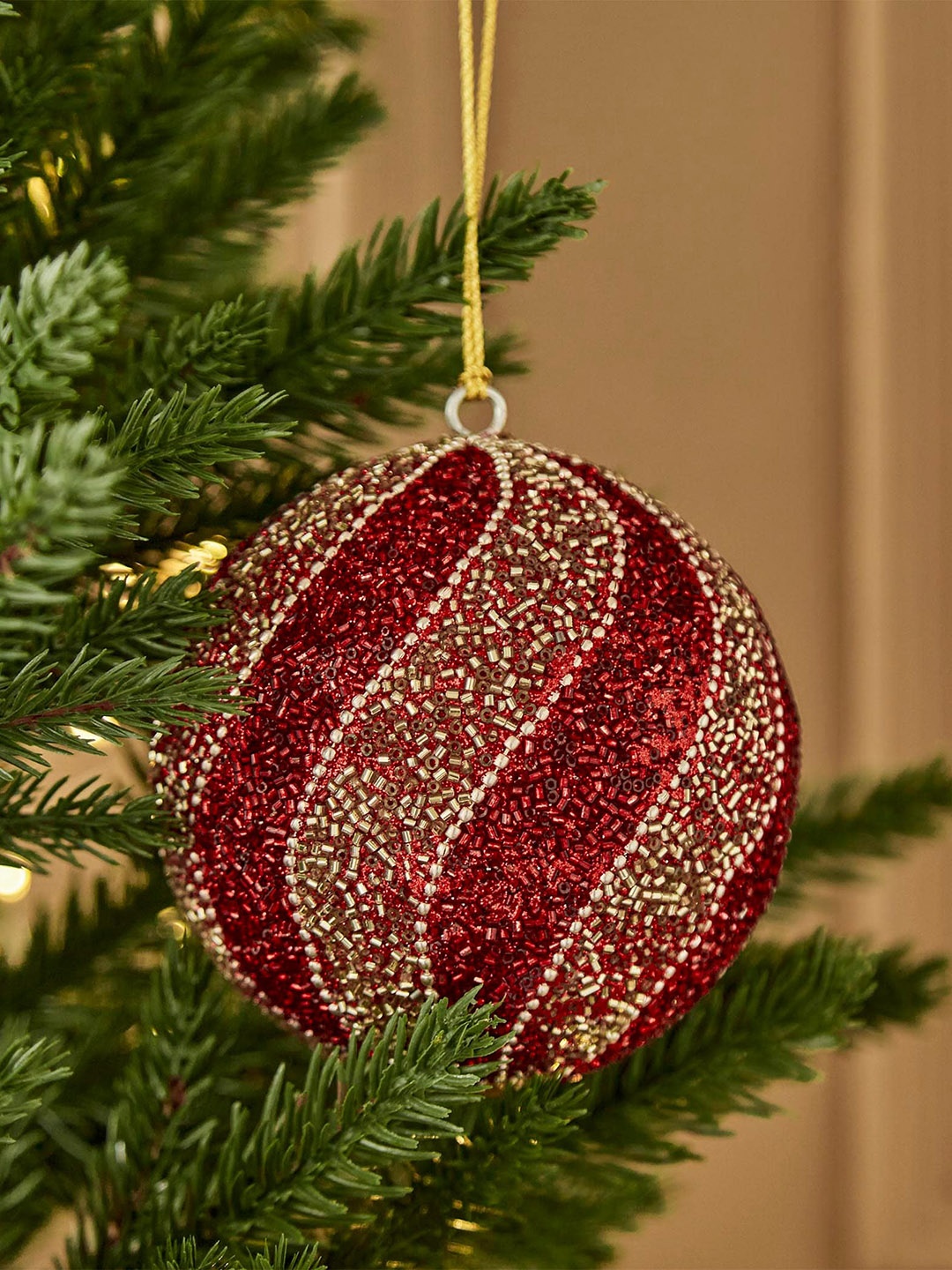 

Home Centre Red Textured Bead Embellished Round Bauble