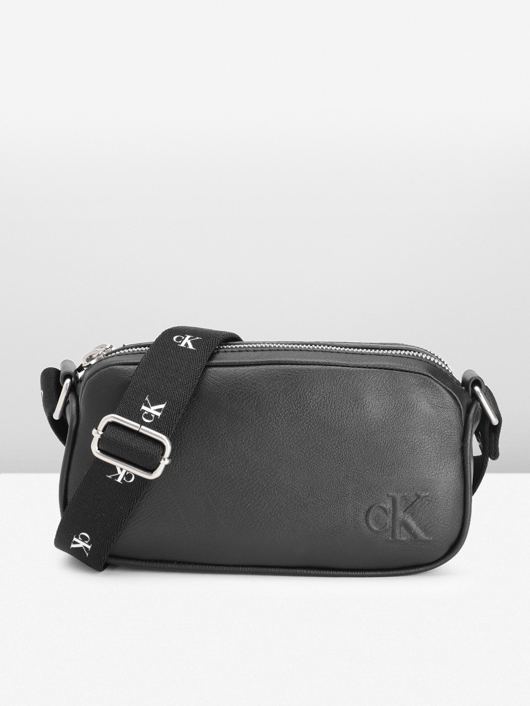 

Calvin Klein Women Solid Sling Bag, Black
