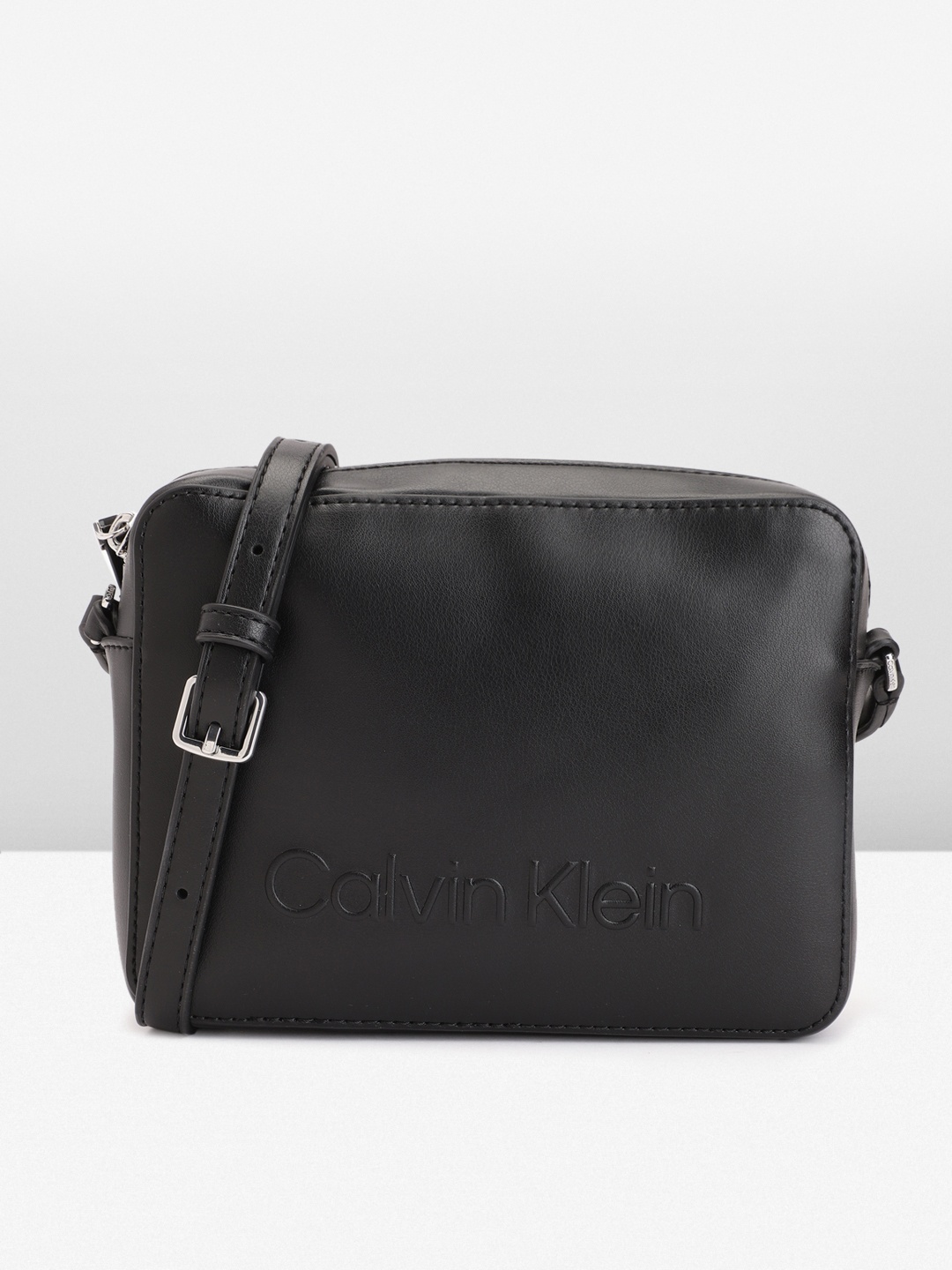 

Calvin Klein Brand Logo Sling Bag, Black
