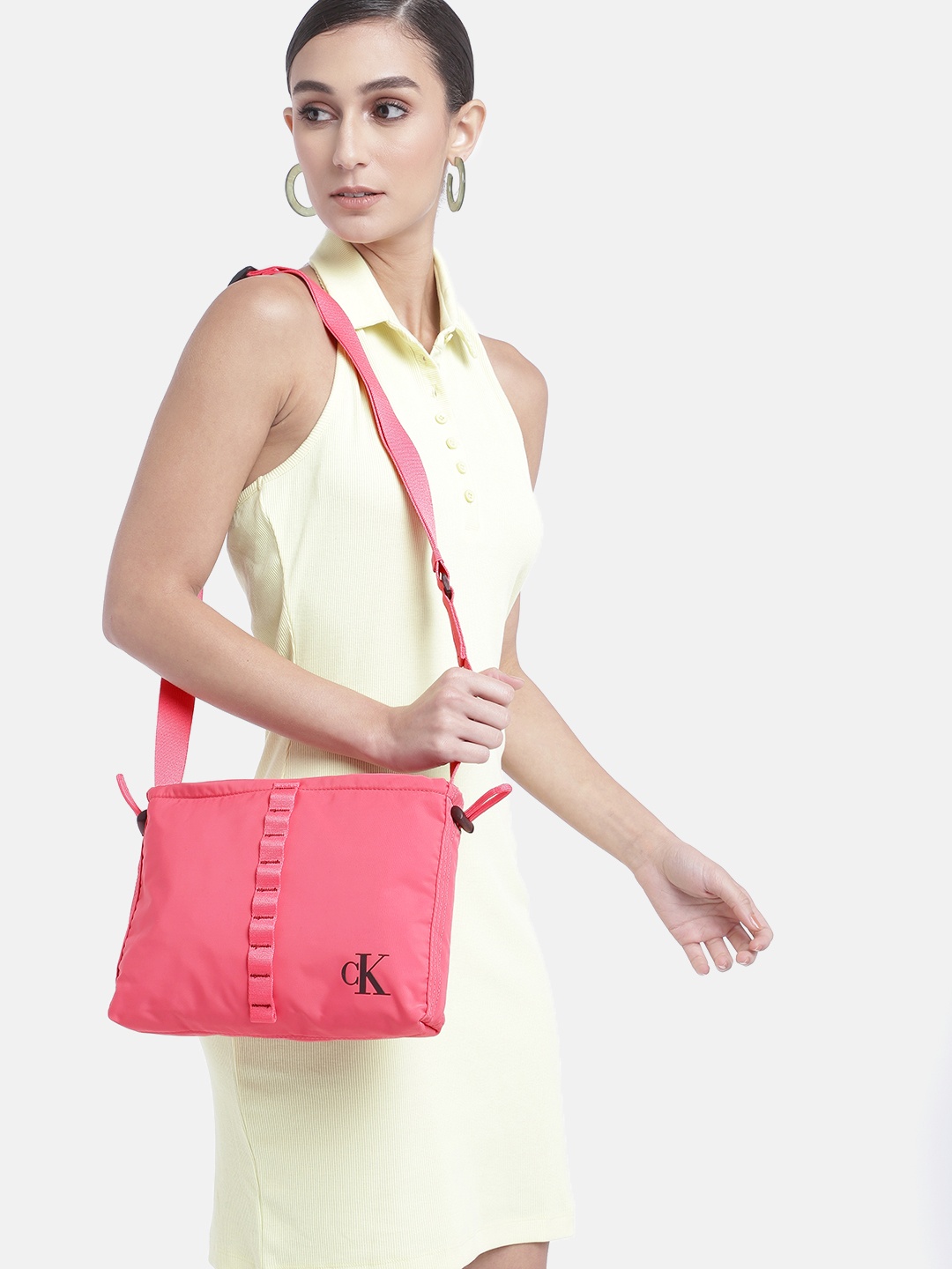 

Calvin Klein Solid Structured Sling Bag with Cinched Applique Detail & Toggle, Pink