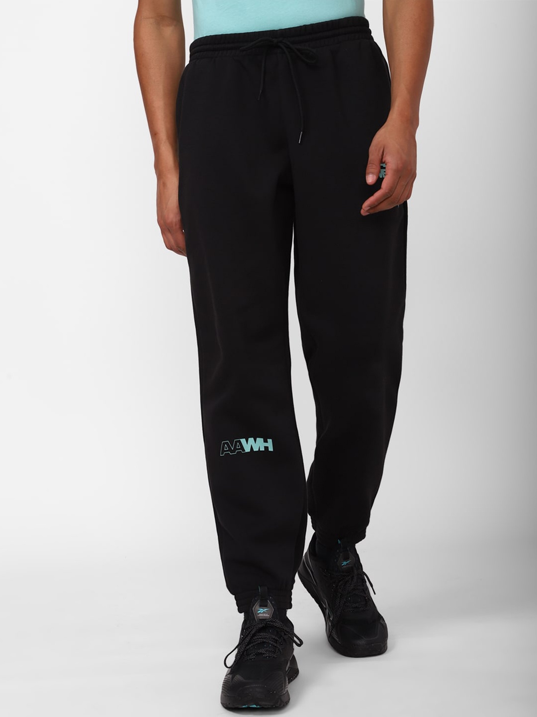 

Reebok Men Printed Joggers, Black