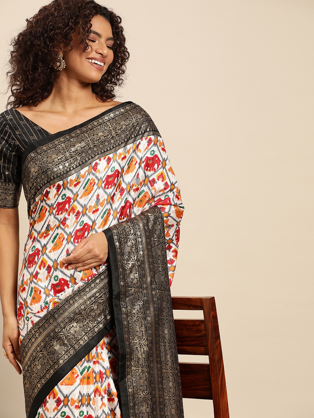 

LOOKNBOOK ART Black Dola silk with patola printed saree