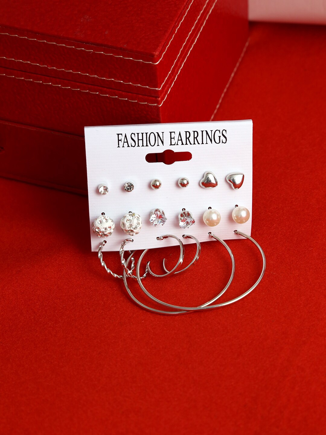 

The Pari Set of 9 Silver-Plated Contemporary Half Hoop Earrings