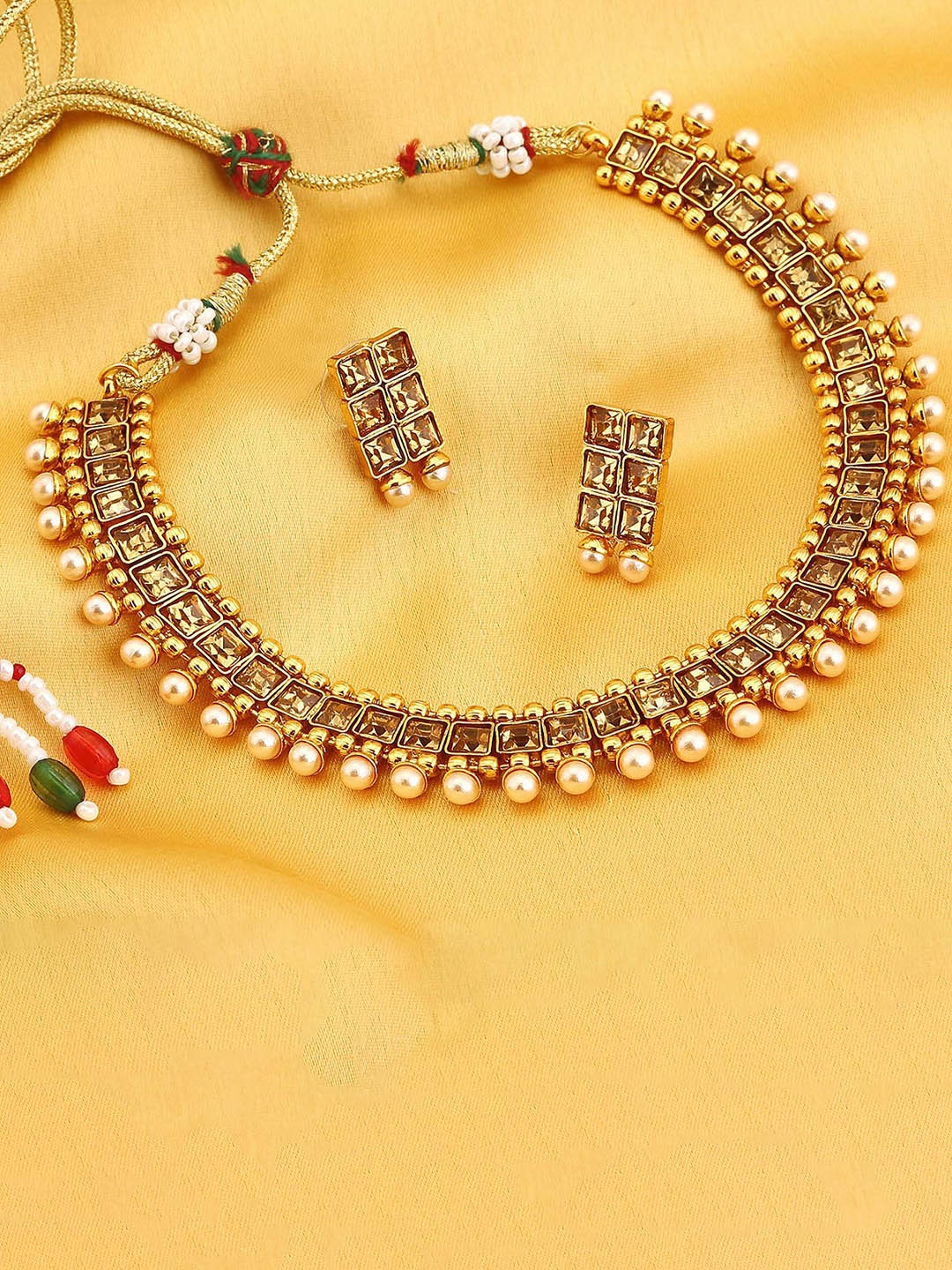 

The Pari Gold-Plated AD Studded & Beaded Jewellery Set