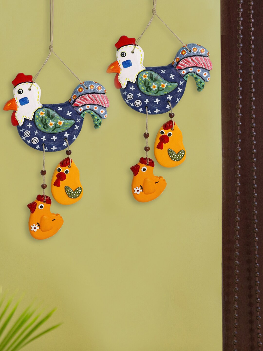 

ExclusiveLane Blue and Yellow Set Of 2 Rooster Chicks Shaped Terracotta Wall Hangings