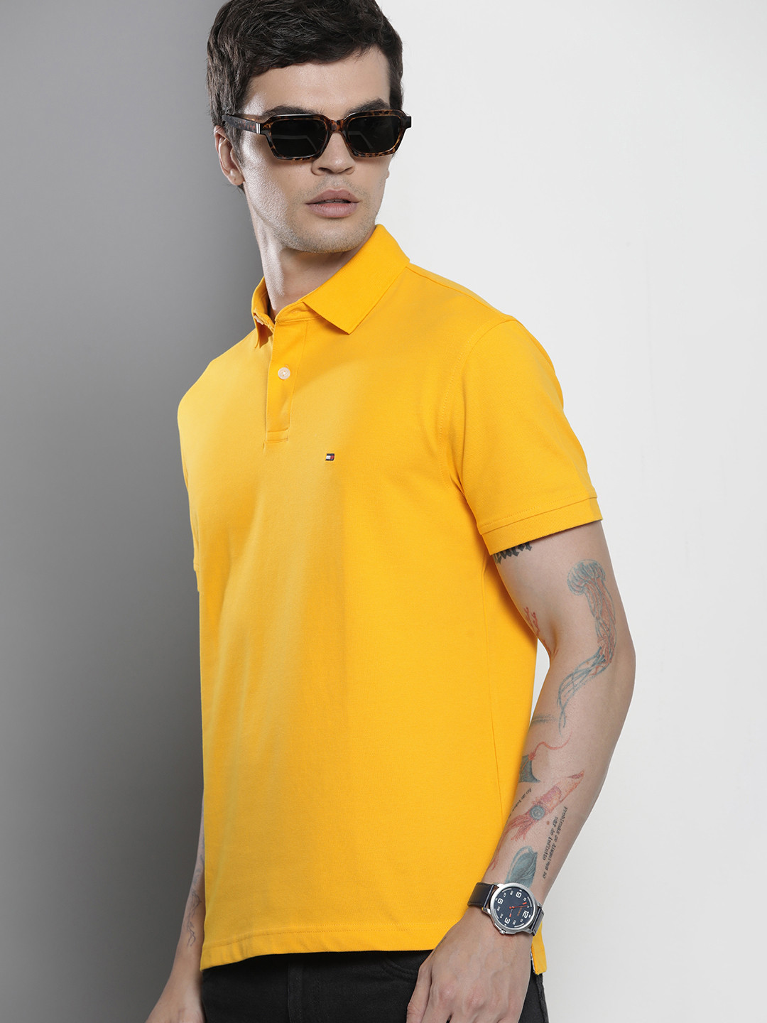 

Tommy Hilfiger Men Solid Short Sleeves Polo Collar Casual T-shirt, Yellow