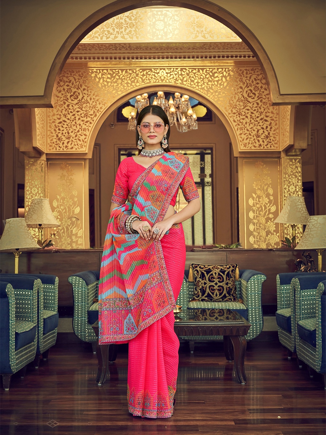 

Vrundavan ethics Peach-Coloured & Blue Floral Sequinned Pure Georgette Leheriya Saree