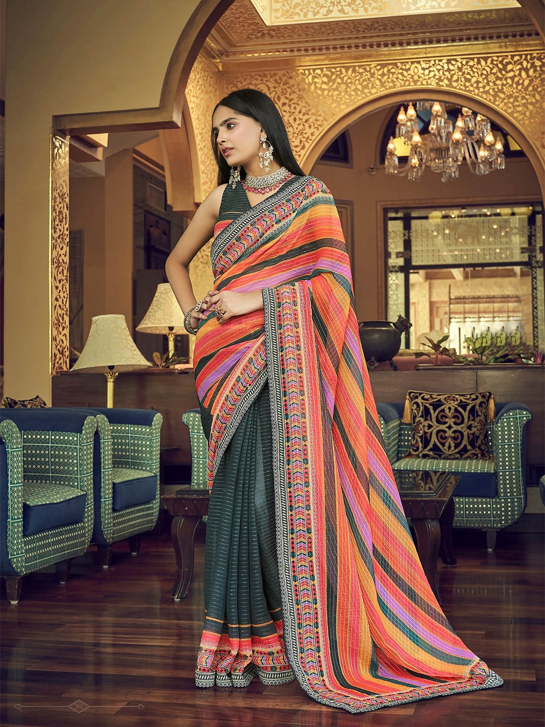 

Vrundavan ethics Black & Orange Embellished Sequinned Pure Georgette Leheriya Saree