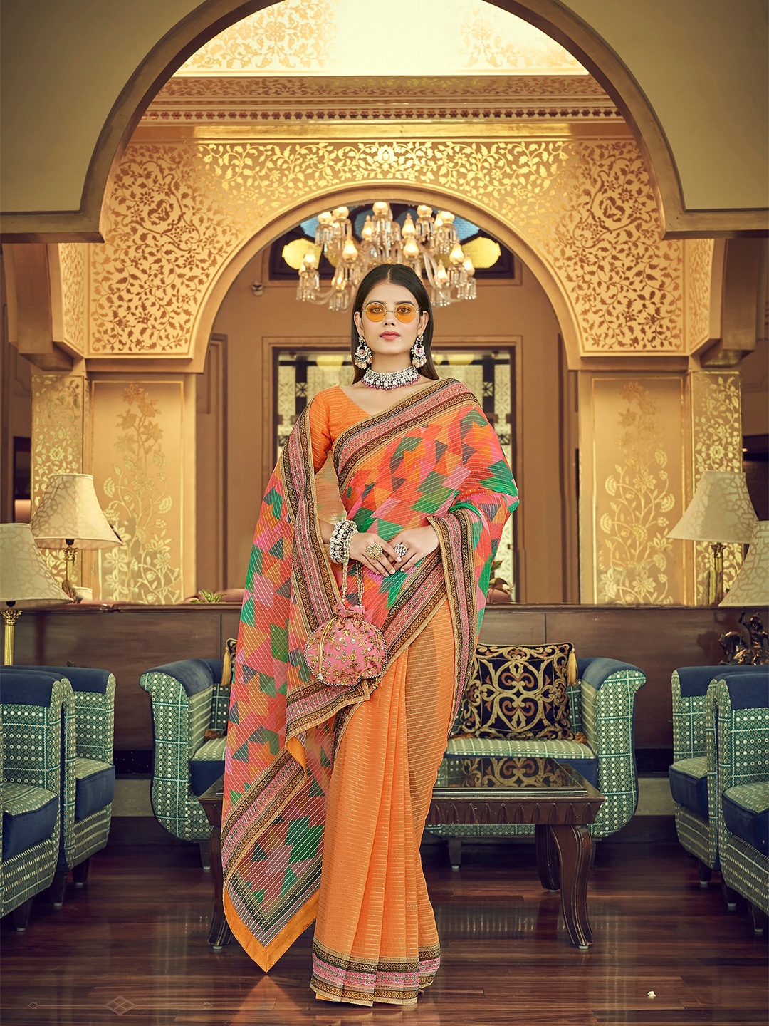 

Vrundavan ethics Orange & Green Sequinned Pure Georgette Leheriya Saree