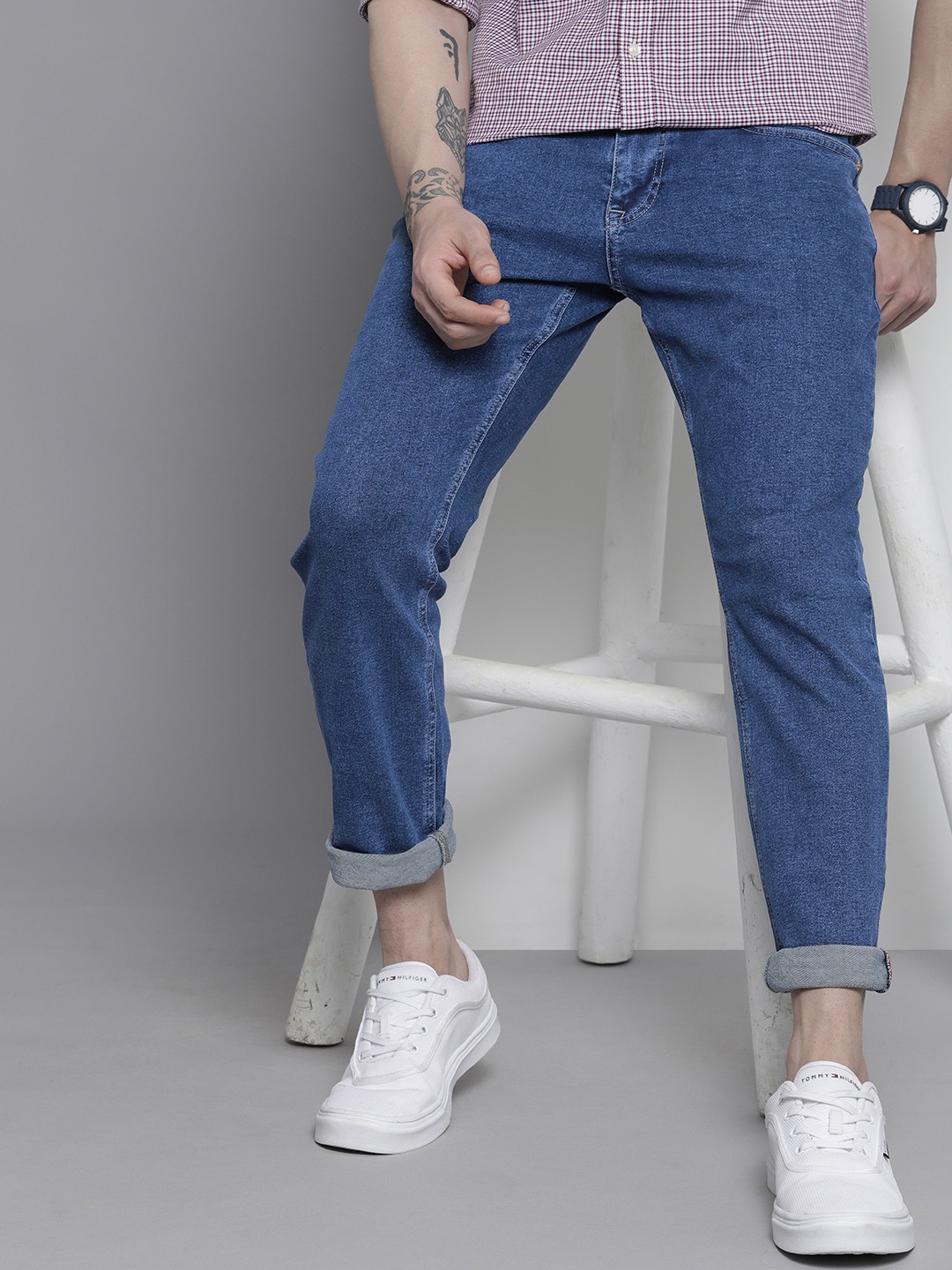 

Tommy Hilfiger Men Tapered Fit Light Fade Stretchable Jeans, Blue