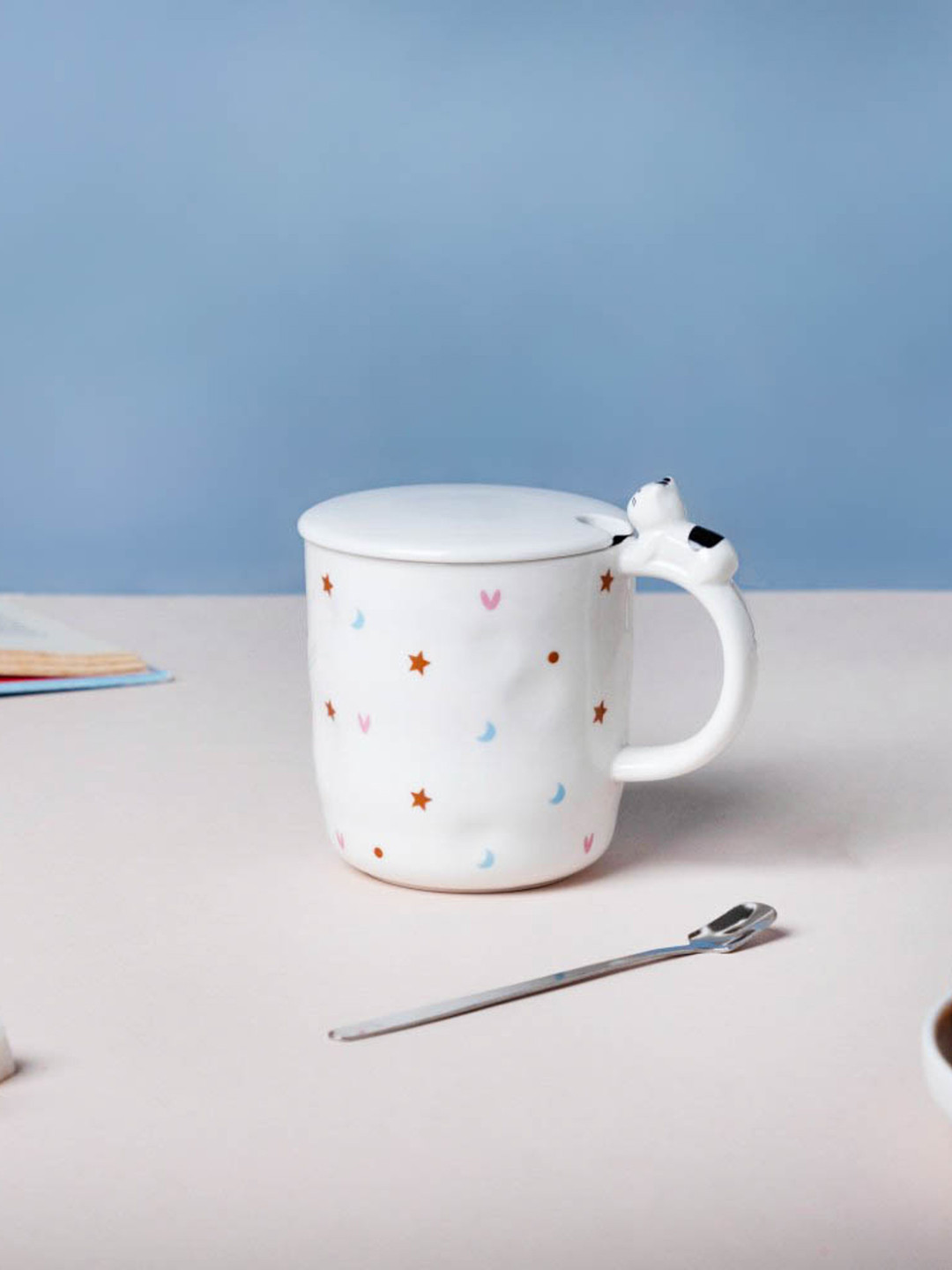 

Nestasia Hearty Party Starry White & Orange Printed Ceramic Glossy Mug Lid & Spoon 300 ml