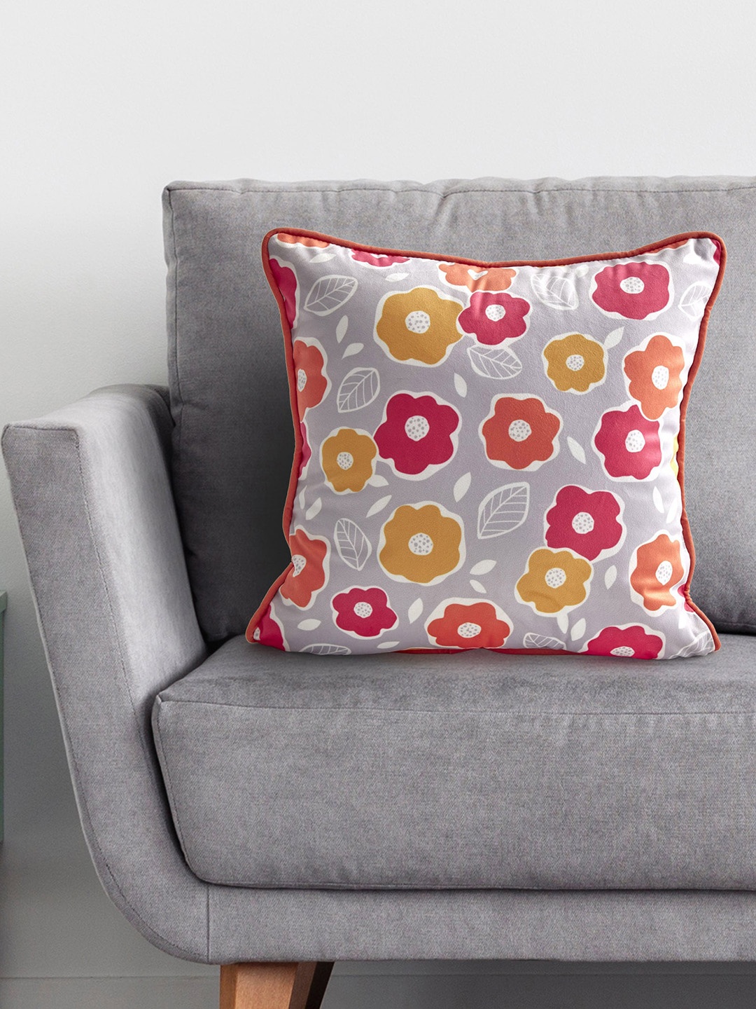 

Home Centre Orange Printed Floral Cushion