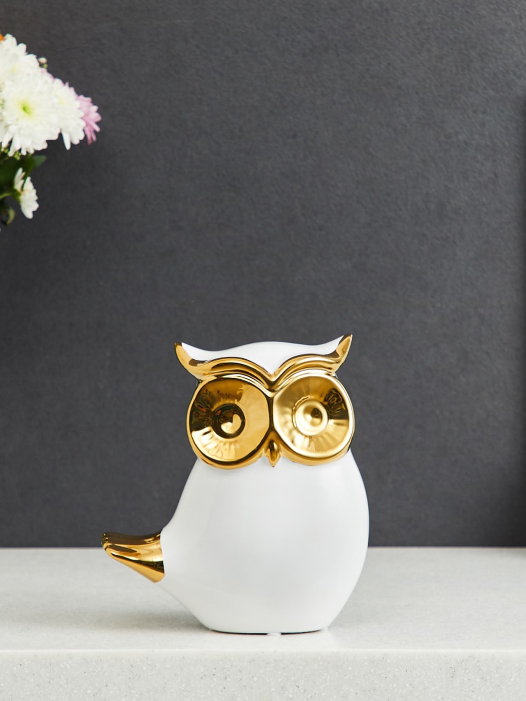 

Home Centre White & Gold-Toned Textured Owl Figurine Showpiece