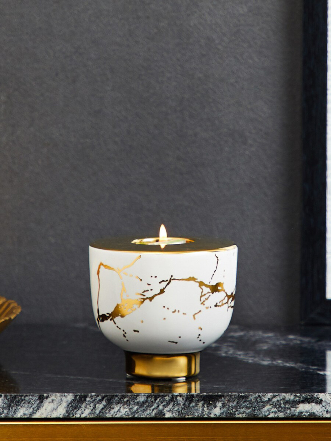 

Home Centre Novelty White & Gold-Toned Abstract Printed Ceramic Candle Holder
