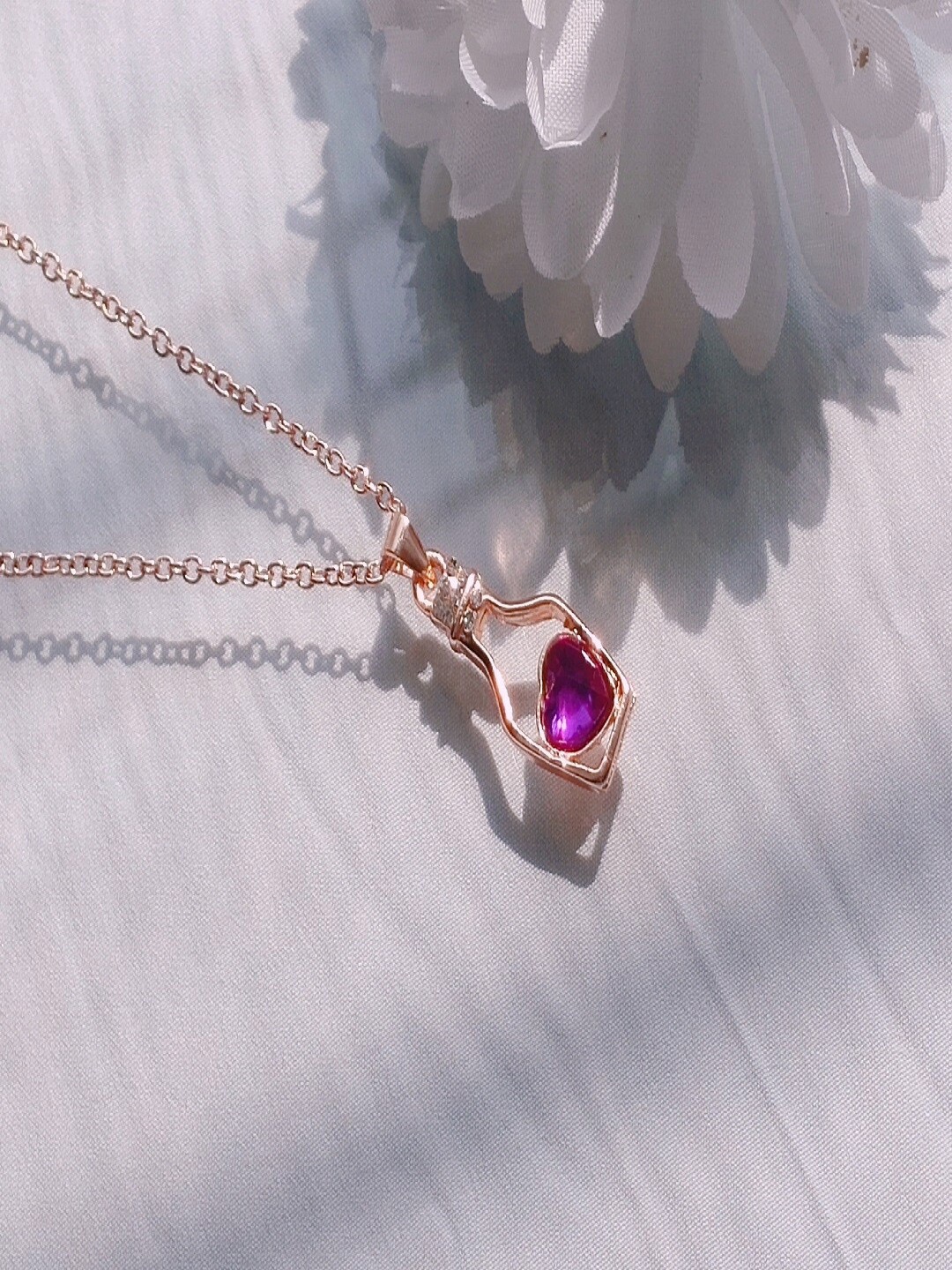 

Mahi Rose Gold-Plated Stone-Studded Bottle Heart Pendant With Chain
