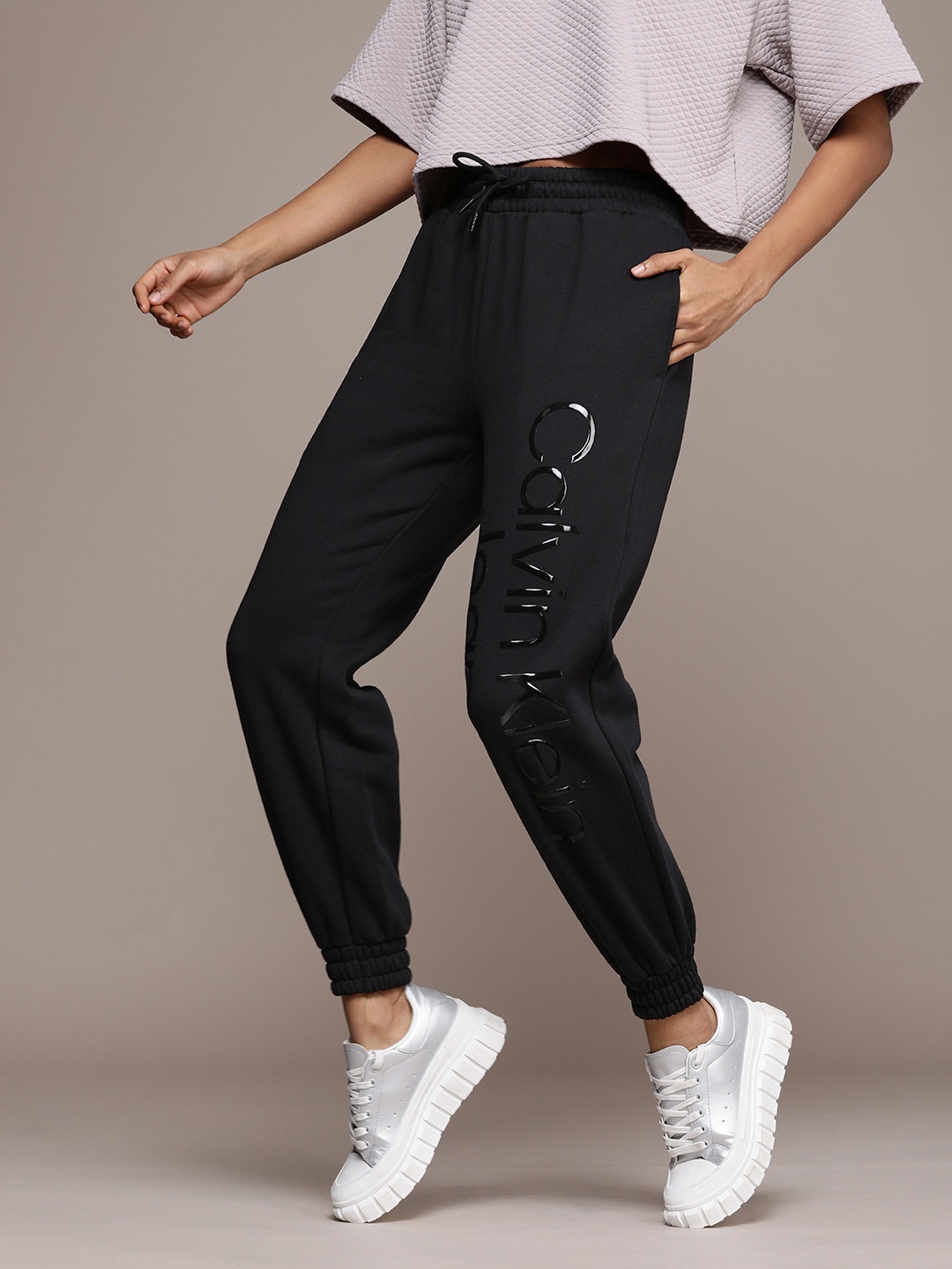 

Calvin Klein Jeans Women Relaxed Fit Brand Logo Printed Joggers, Black