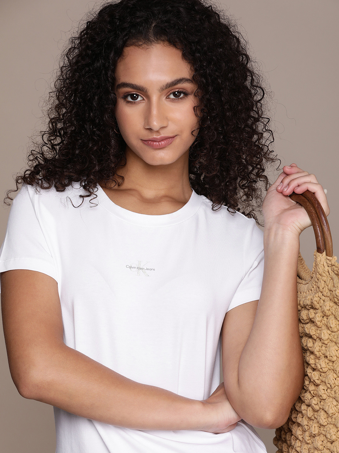 

Calvin Klein Jeans Women Solid Slim Fit T-shirt With Brand Logo Detail, White