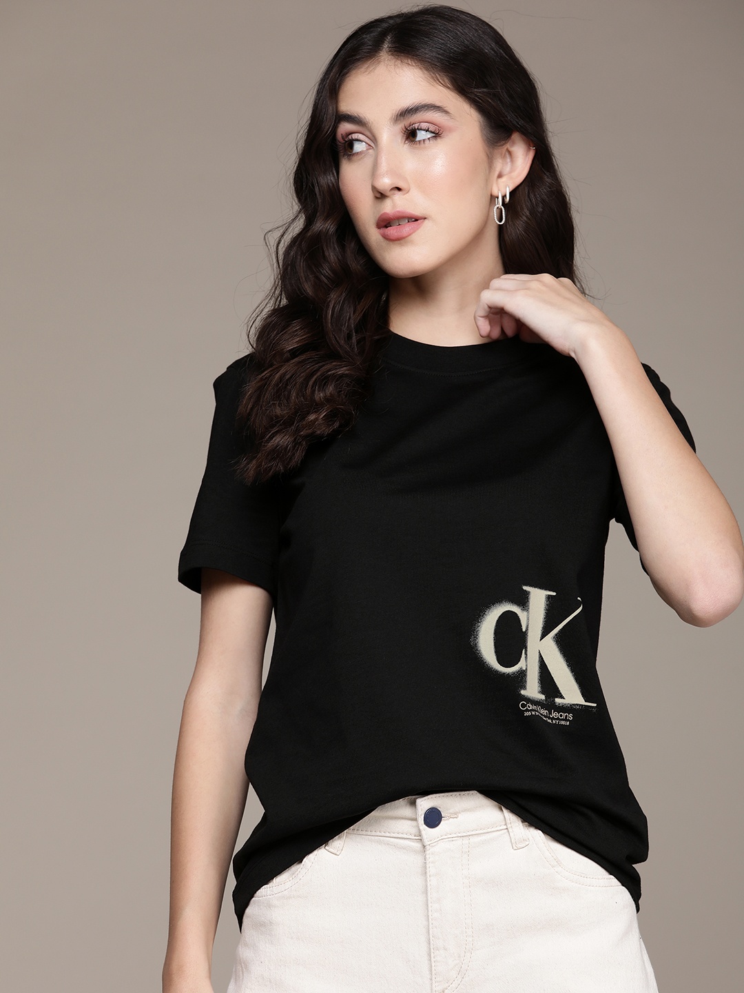 

Calvin Klein Jeans Women Pure Cotton Brand Logo Printed T-shirt, Black