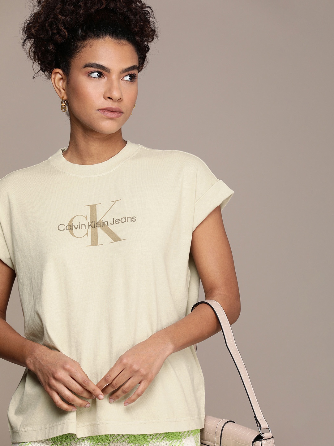 

Calvin Klein Jeans Women Pure Cotton Brand Logo Printed Extended Sleeves T-shirt, Beige