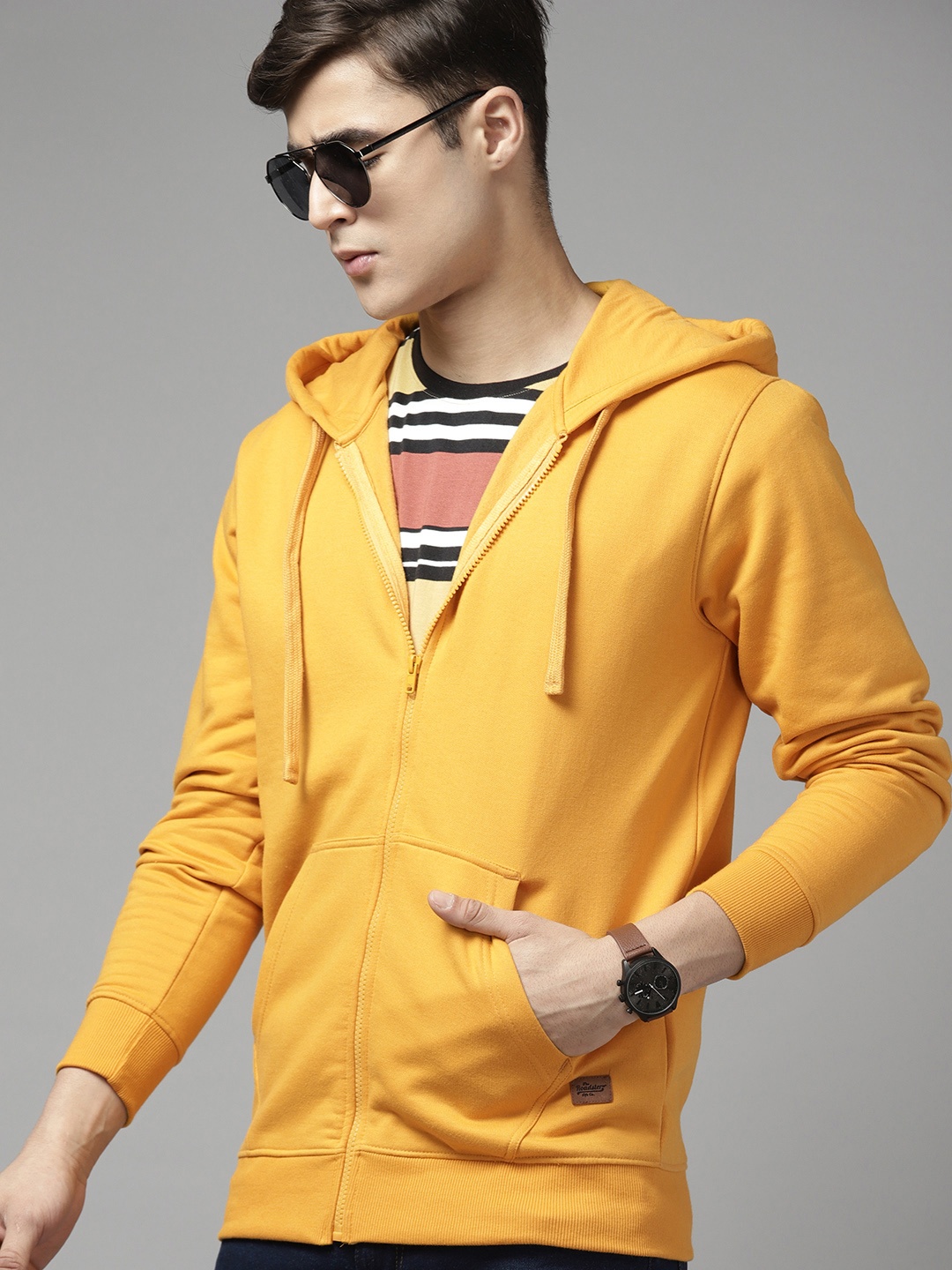 

Roadster Men Solid Hooded Sweatshirt, Yellow