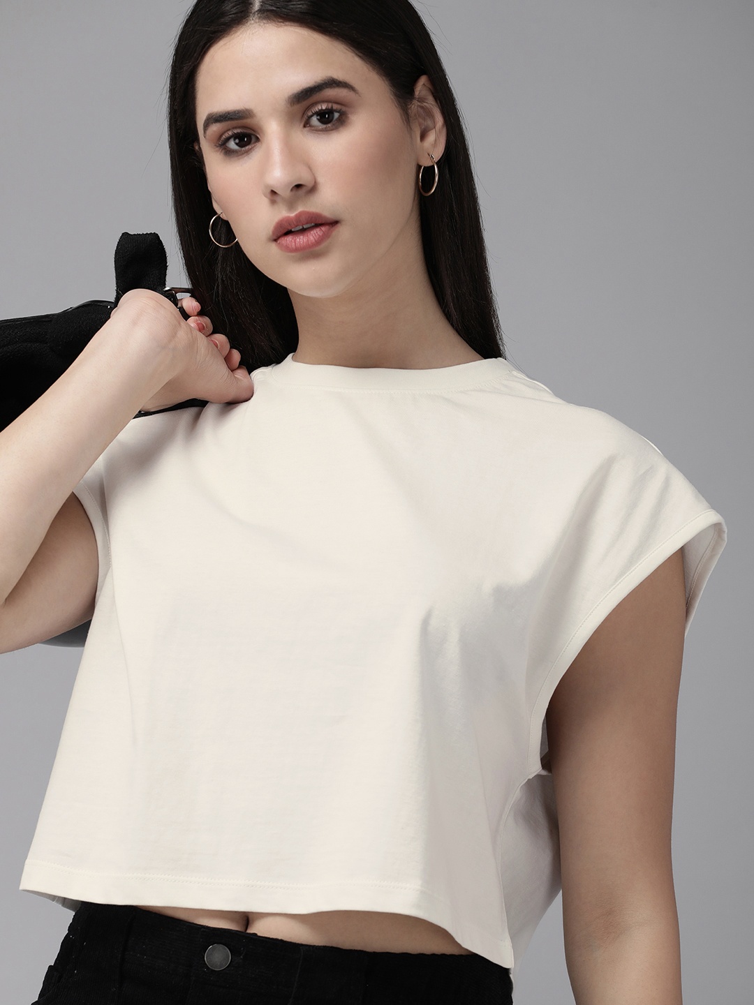 

Roadster Women Solid Boxy Crop T-shirt, Off white