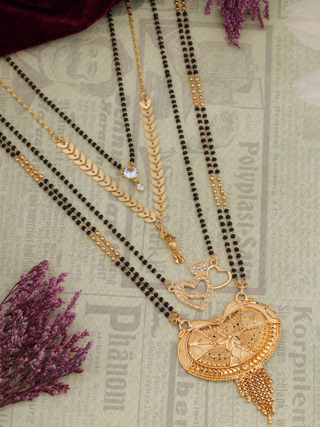 

Brado Jewellery Tanmaniya Set Of 4 Gold-Plated AD Stone-Studded & Black-Beaded Mangalsutra