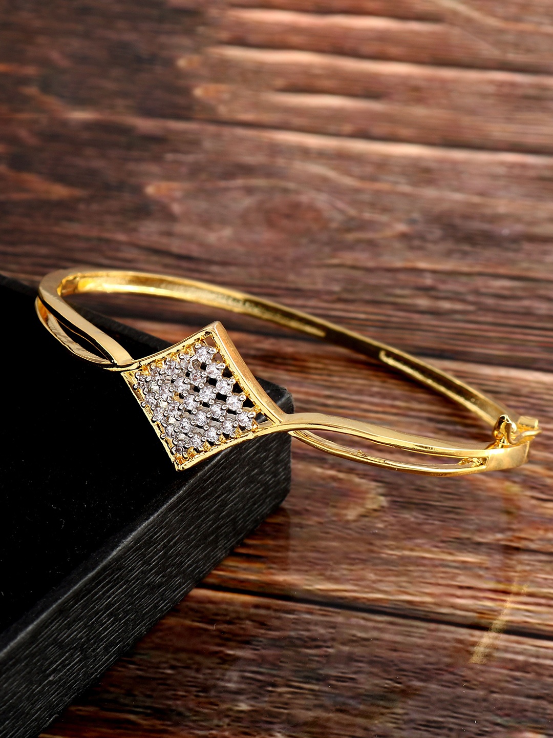 

Jewar Mandi Women Brass Cubic Zirconia Antique Gold-Plated Bangle-Style Bracelet