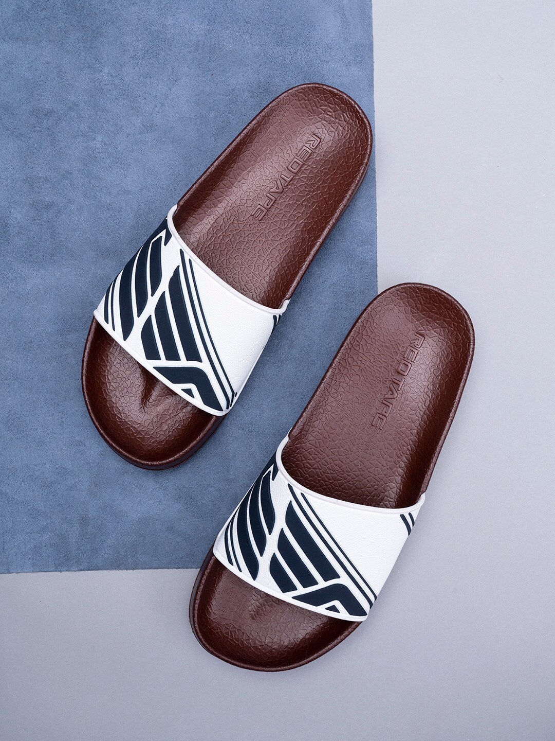 

Red Tape Men Printed Rubber Sliders, Maroon