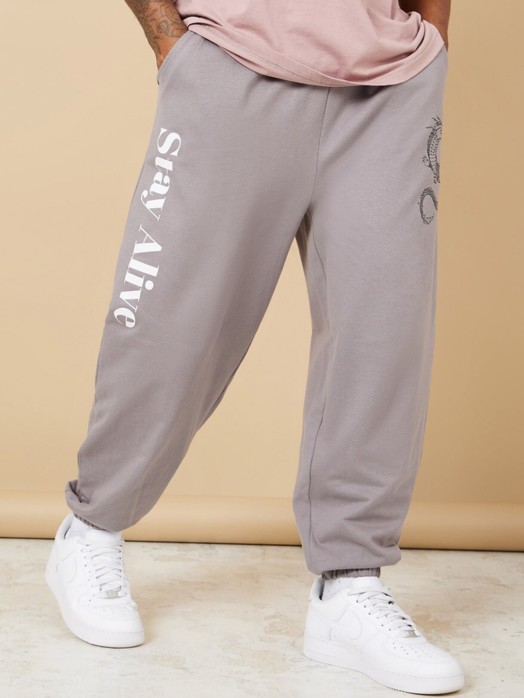 

Styli Men Oversized Printed Jogger with Elasticated Hem, Grey