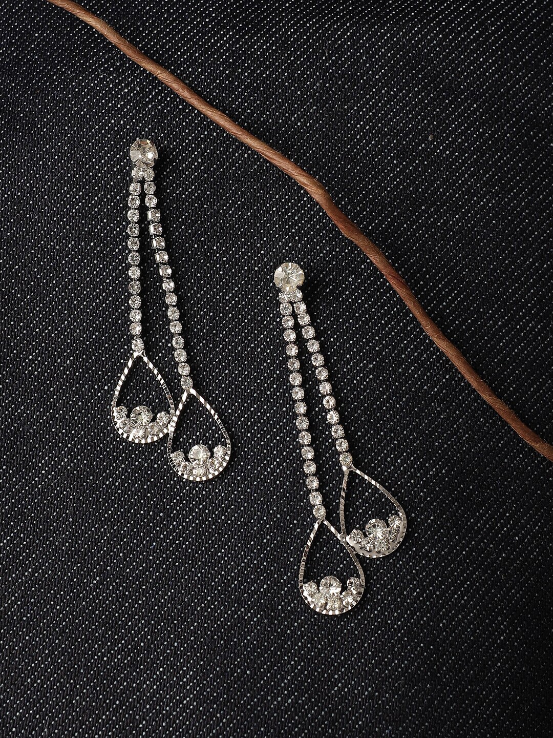

SOHI Silver-Plated Contemporary Drop Earrings